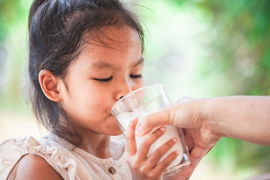 mother-hand-giving-glass-of-milk-to-her-child-with-care-and-love-3