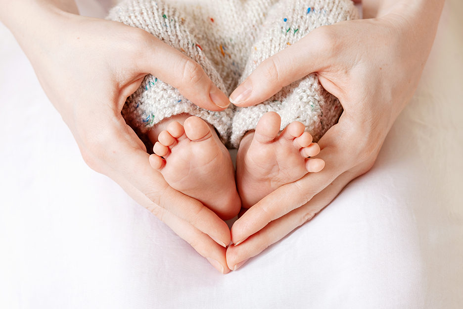 baby-feet-in-mother-hands-tiny-newborn-babys-feet-on-female-he