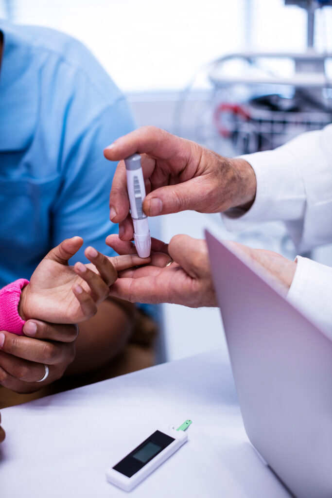 doctor-checking-patient-sugar-level-2